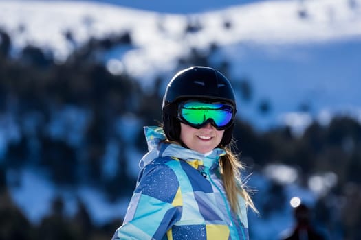 Portrait of smiling Caucasian white woman, skier with ski helmet and goggles. Winter holidays in El Tarter, Grandvalira, Andorra