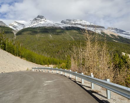 Winding Columbia icefield highway and Canadian Rockies mountains in Jasper National Park, Alberta, Canada
