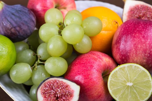 Assortment fruits on wooden table