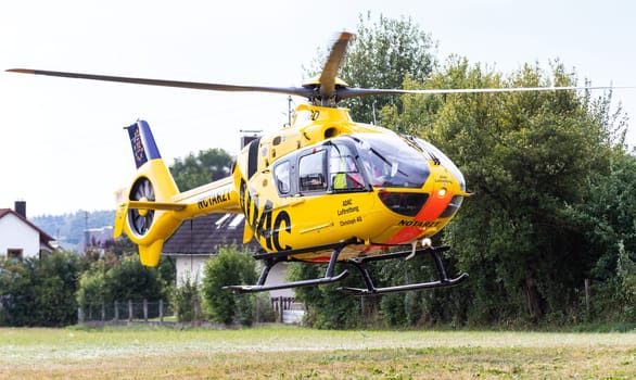 Zusmarshausen, Bavaria/Germany - August 7, 2018, rescue operation, german rescue helicopter, ADAC, Christoph 40, takeoff