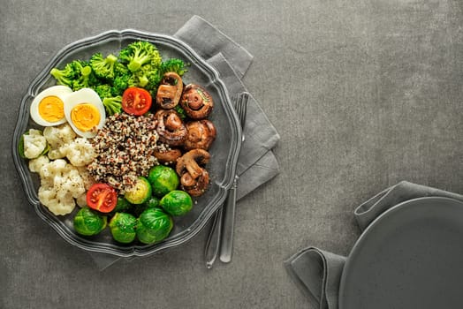 Healthy meal with cooked and roasted vegetables and quinoa seeds. Healthy vegetable diet meal.