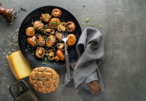 Fresh mushrooms Cooking in pan. Healthy meal with cooked and roasted champignon. Healthy vegetable diet meal
