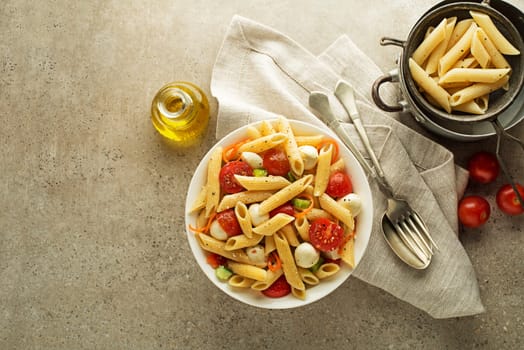 Pasta meal with mozzarella cheese and vegetables. Healthy pasta meal.