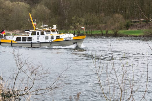 ESSEN, NRW, GERMANY - APRIL 4, 2016:.River supervisor boat Bussard MS at a check ride on the river Ruhr in Germany. Boat in use for water protection..