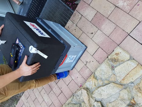 HEILIGENHAUS, NRW, GERMANY - JULY 25, 2017:.Homeservice, delivery of department store chain Real in Germany delivers crate of fresh food home.