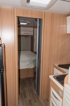 MUELHEIM RUHR  NRW  GERMANY - AUGUST 29  2017:.Vehicle interior view from a camper with view in bedroom with queen bed.
