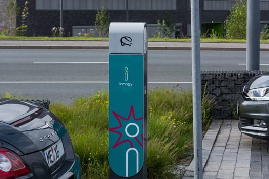 HEILIGENHAUS, NRW, GERMANY - AUGUST 24, 2017: Parking in Heiligenhaus charging of modern electric car on the road is the future of the automobile