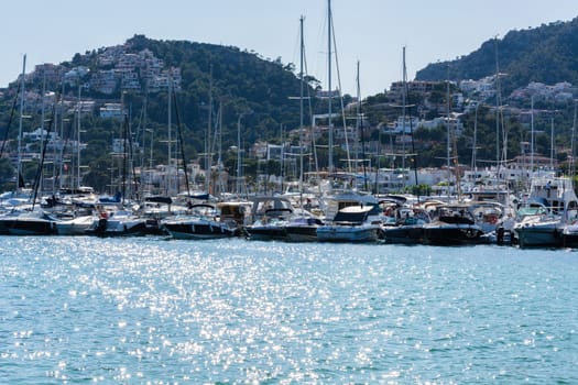 PORT ANDRATX, SPAIN - JUNE 01, 2016:.View of the Bay of Port Andratx Mallorca Baleares Spain. In the background motor boats and sailboats.
