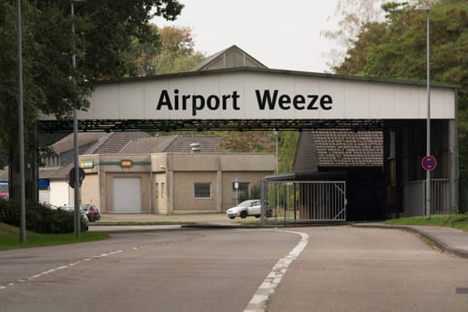 WEEZE, NRW, GERMANY - SEPTEMBER 10, 2018:.Military outward access to Weeze Airport with old barracks buildings