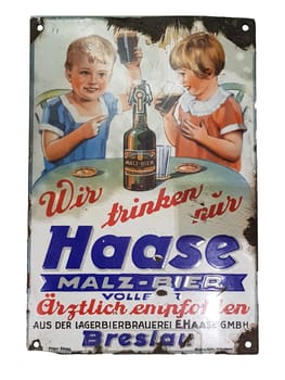MUELHEIM RUHR  NRW  GERMANY-AUGUST 17  2018:.Antique advertising sign made of enamel with advertising for a malted beer drink for children.