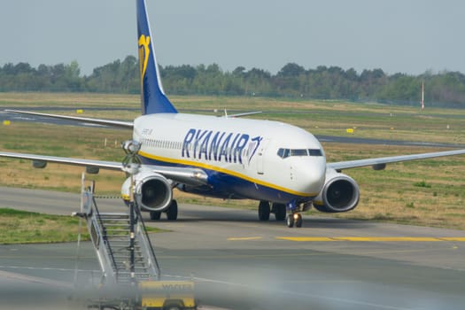 WEEZE, NRW, GERMANY - SEPTEMBER 11, 2018:.Airplane of the airline Ryanair on the runway of Weeze airport.