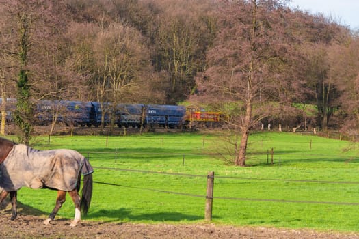 RATINGEN, NRW, GERMANY - DECEMBER 28, 2015:.Locomotive at the railroad crossing in Ratingen at the moated castle "house to house"". By propelled fast train towards Muelheim - food."
