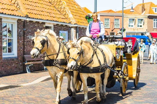 ZIERIKZEE, ZEELAND, NETHERLANDS - JUNE 15, 2015:.Carriage ride through the beautiful old port town of Zierikzee, Zeeland in the Netherlands.