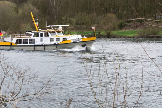 ESSEN, NRW, GERMANY - APRIL 4, 2016:.River supervisor boat Bussard MS at a check ride on the river Ruhr in Germany. Boat in use for water protection..