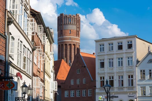 LÜNEBURG, NIEDERSACHSEN, GERMANY - JULI 27, 2018:.Half-timbered red brick houses near the river on the old harbor Lueneburg, Germany