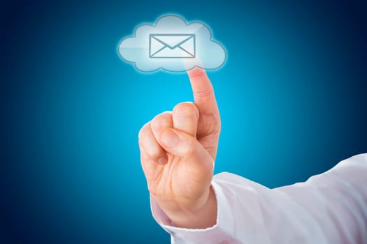 Close up on a transparent cloud computing button activated from behind by touch of a male index finger. The cloud symbol displays an email icon and is lighting up over a blue background with gradient.