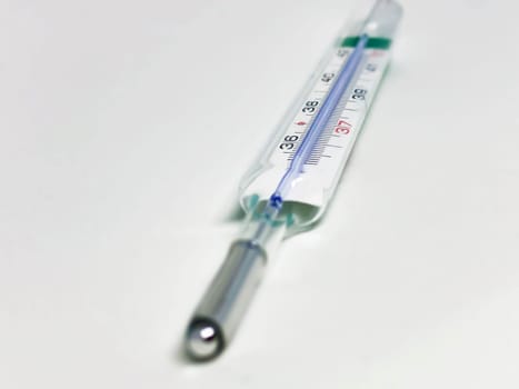 a mercury thermometer isolated on a white background. Medical measuring instrument. Virus and flu