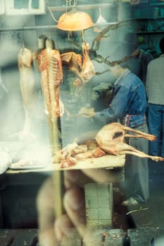 fresh meat at the meat and animal Market in the city of Guangzhou in the province of Guangdong in china in east asia.   China, Guangzhou, April, 2000