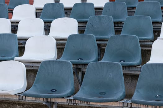 empty seats in the Sports Stadium, Grey and white
