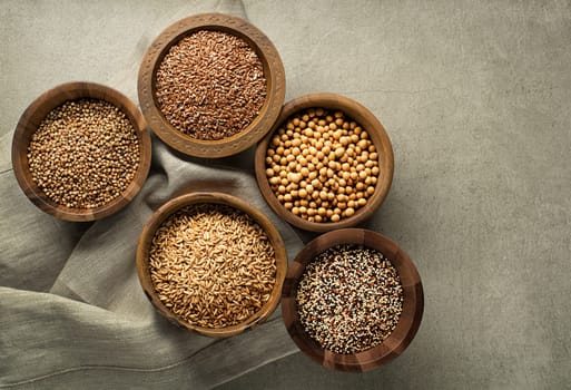 Various of healthy seeds and cereals - flax seed, chia seeds, soybean, buckwheat and oats. Copy space.