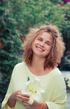 Outdoor portrait of a beautiful woman smiling. Positive emotion concept