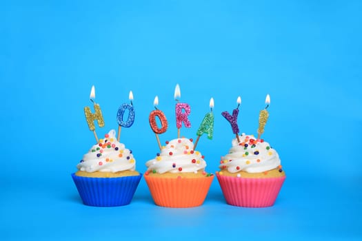 Happy Birthday Cupcakes With Candles That Say Hooray