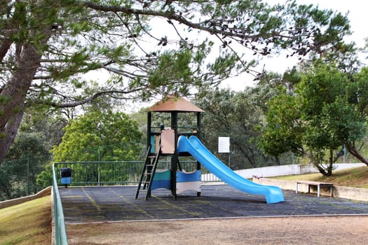 Close up view of a children's playground slide on a park.