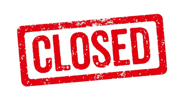 A red stamp on a white background - Closed