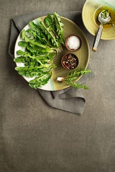 Fresh dandelion leaves overhead shoot. Healthy spring natural organic food concept - Image