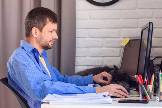 Freelancer employee at work at home in his workplace