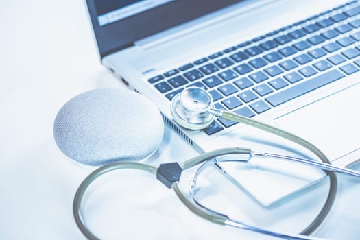 Home Office Medicine - PC with mask, stethoscope for protection against virus, infection, diagnosis and documentation.