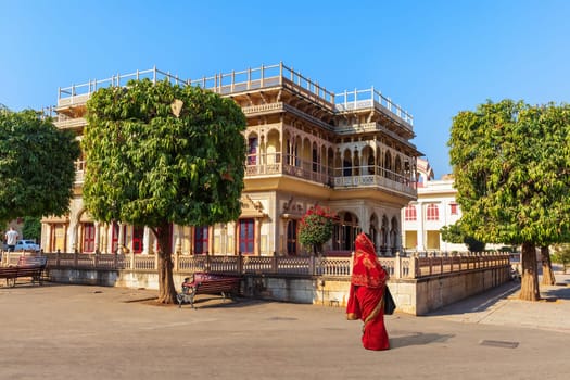 Mubarak Mahal City Palace and an Indian woman, Jaipur, India.
