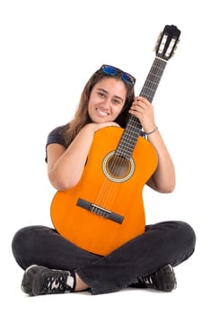 Happy girl posing with guitar, isolated in white