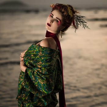 Fine art portrait of european woman in Japanese Geisha style wearing kimono