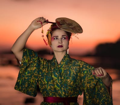 Fine art portrait of european woman in Japanese Geisha style wearing kimono