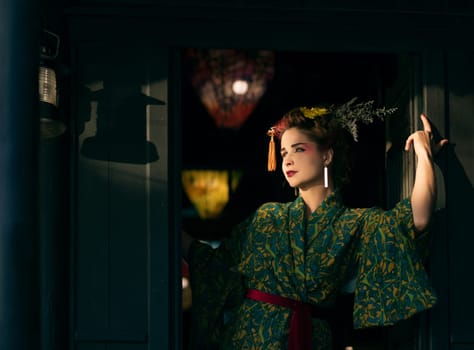Fine art portrait of beautiful woman in Japanese Geisha style wearing kimono