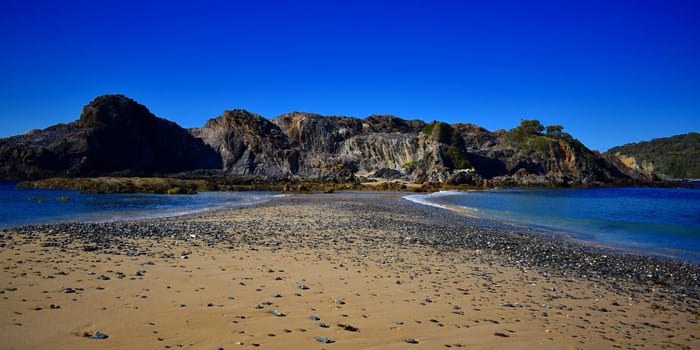 An island with a sand walk way