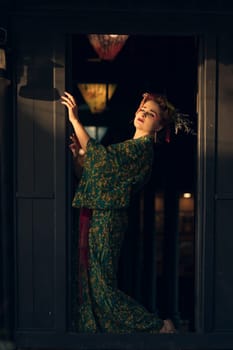 Fine art portrait of beautiful woman in Japanese Geisha style wearing kimono