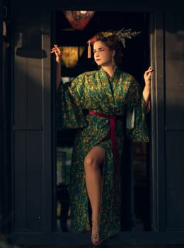 Fine art portrait of beautiful woman in Japanese Geisha style wearing kimono