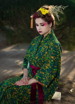 Fine art portrait of beautiful woman in Japanese Geisha style wearing kimono