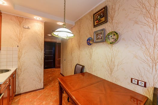 Russia, Moscow- November 15, 2019: interior room apartment modern bright cozy atmosphere. general cleaning, kitchen, dining area