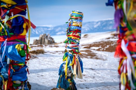 Color shot of shamanic and buddist pray on the Olkhon Island on the Baikal lake, in Russia. View of the sacred and chamanic roc
