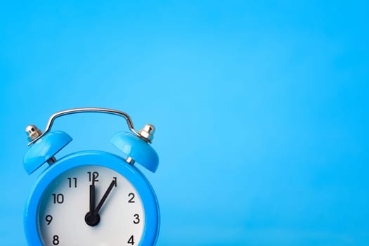 Clock concept - time, right empty place, blue background