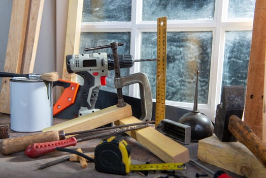 some tools of carpenter in the workshop, near the window