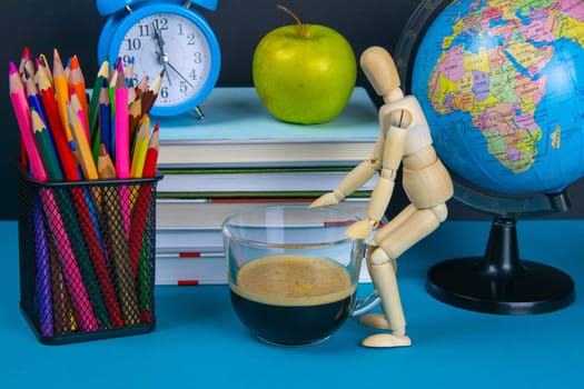 A stack of books with a globe, a glass of pencils, a clock apples and coffee.