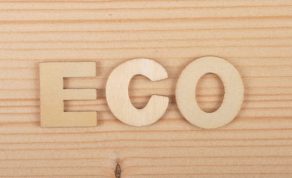 Term from wooden letters on pale wood
