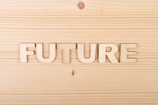 Term from wooden letters on pale wood