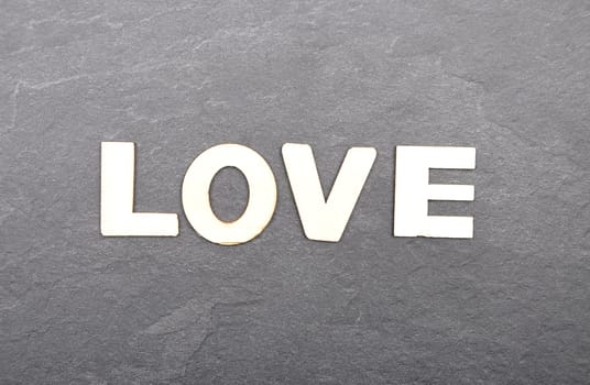Term from wooden letters on slate board