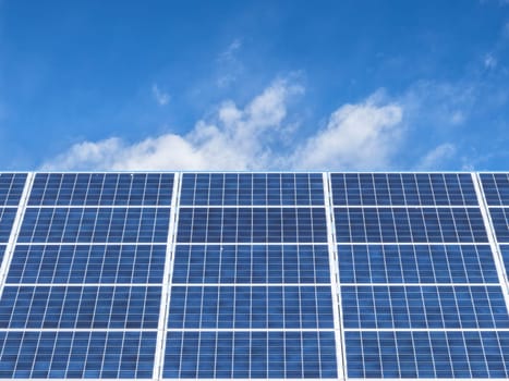 Solar panels for clean energy with a blue sky background. Copy space.