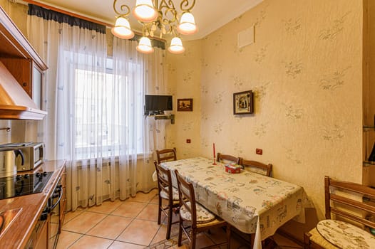 Russia, Moscow- November 20, 2019: interior room apartment modern bright cozy atmosphere. general cleaning, home decoration, preparation of house for sale. kitchen, dining area